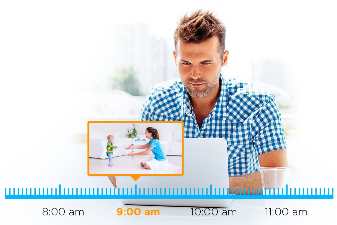 Man watching a tablet showing kids playing at 9:00 am.