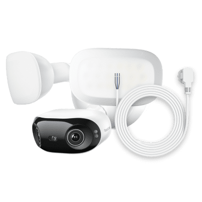 Outdoor security camera kit with floodlight and accessories.