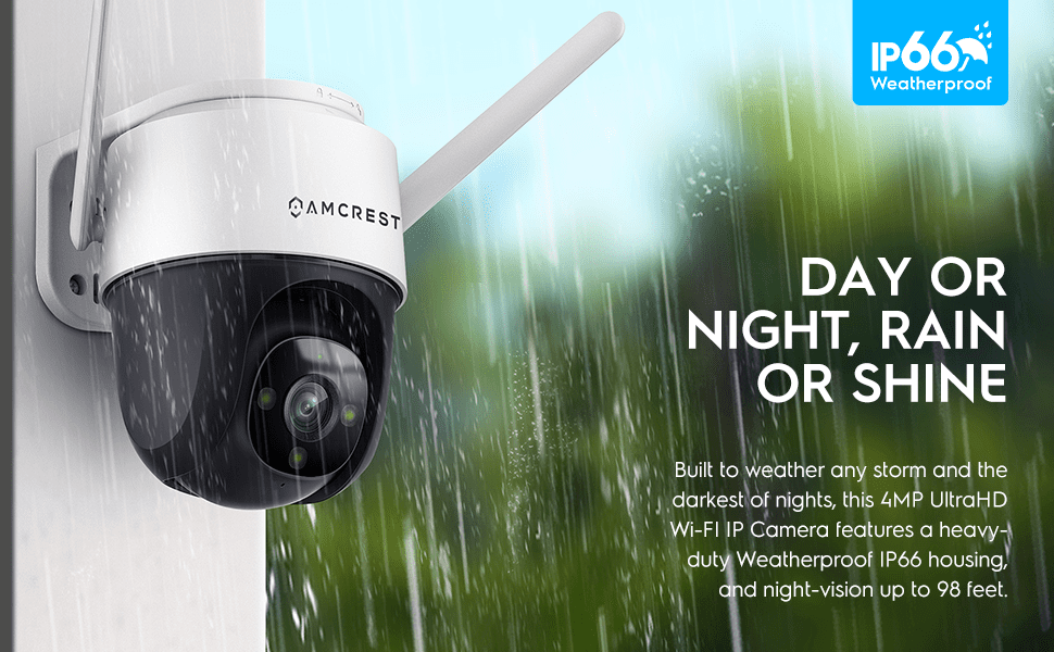 A white outdoor security camera with dual antennas against a blurred green background.
