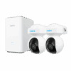 Wireless security camera system with two cameras and a base station.