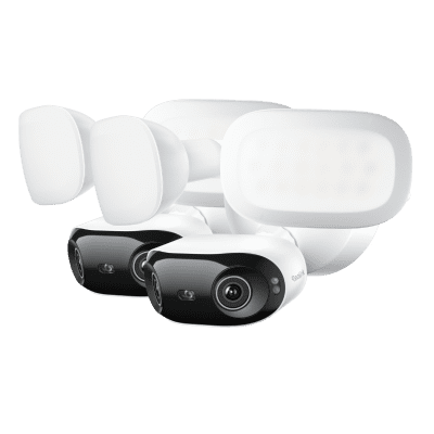 Set of modern white and black security cameras with mounting brackets.