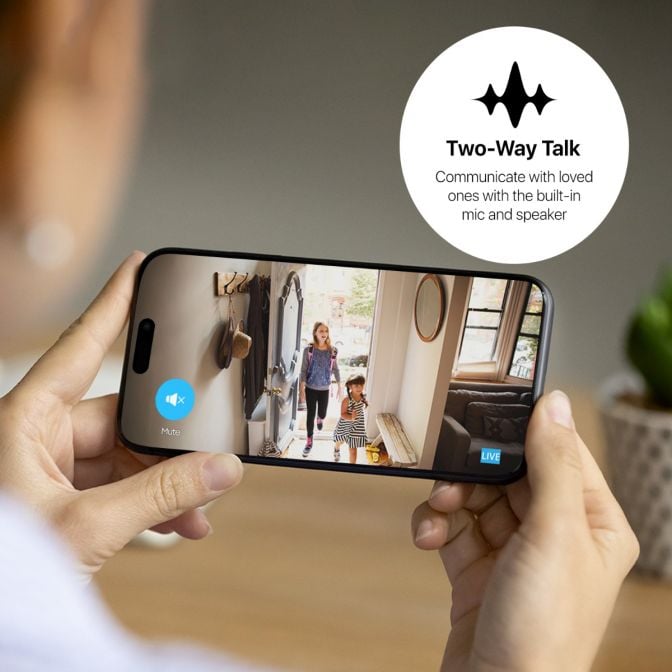 Smartphone displaying True-Way Talk video call with family at home.