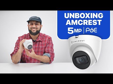 Man unboxing an Amcrest 5MP PoE security camera.