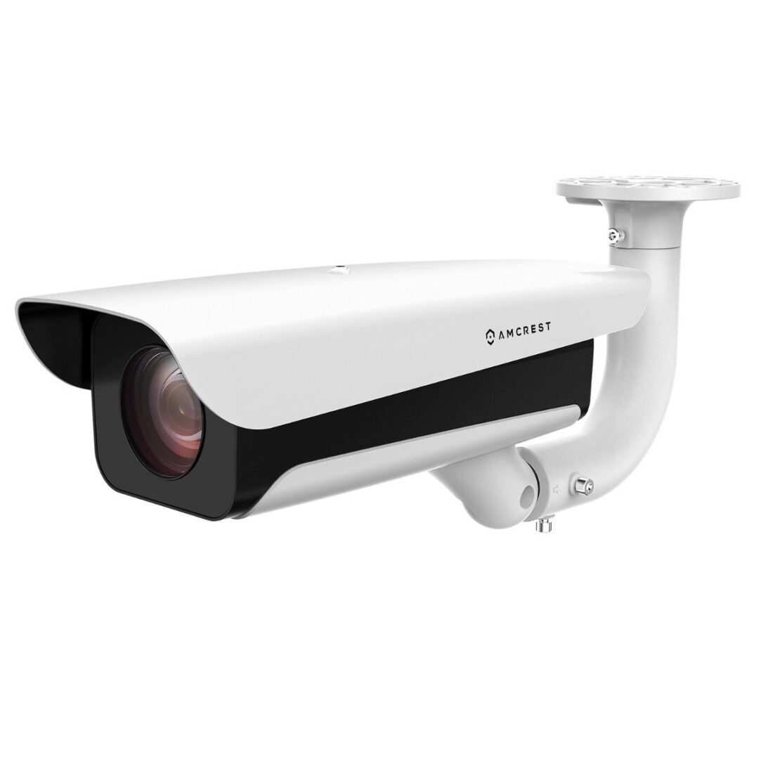 White outdoor security camera with black lens area and mounting bracket.