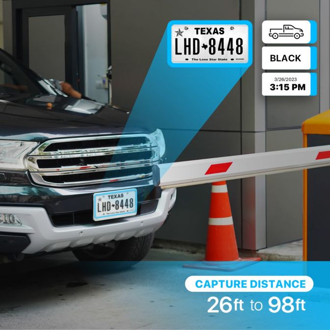 Car with Texas license plate stopped at a security gate with a barrier and traffic cones.