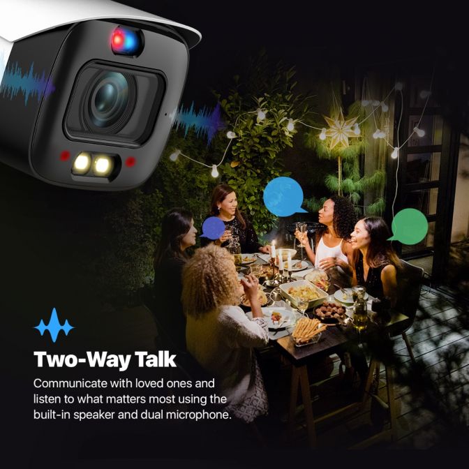 Outdoor security camera with two-way talk feature at a night gathering.